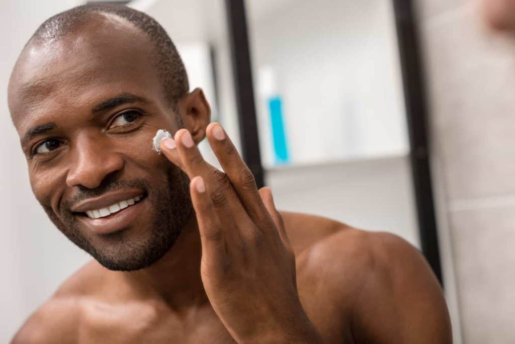 Man Applying Face Moisturizer