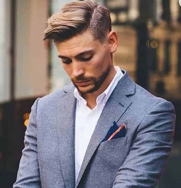 A clean side part, thick hair gives this style natural structure and body